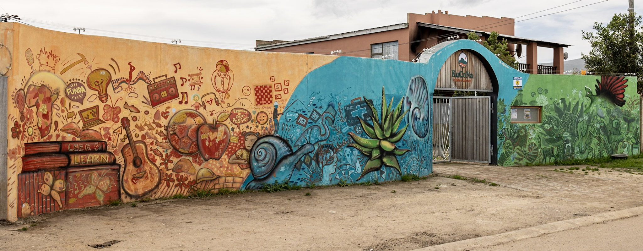 The KuCoNa centre gate and its painted mural wall
