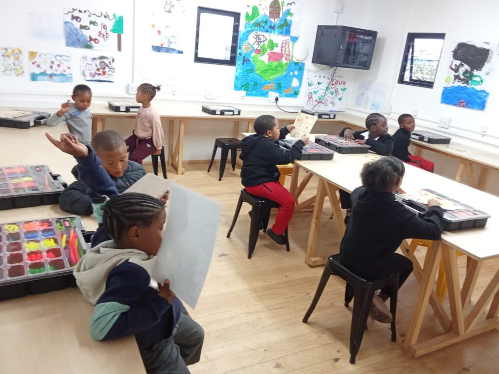 Children taking part in a creative Learning Hub classroom activity