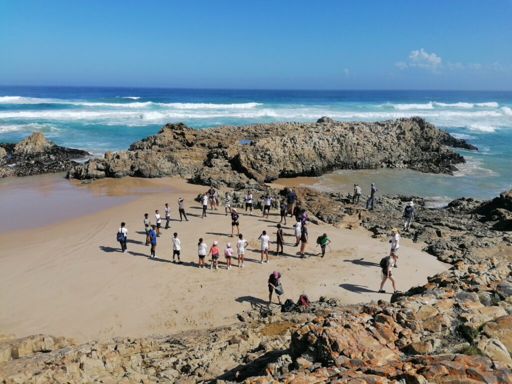 Nature Connect participants gathered on a rocky beach